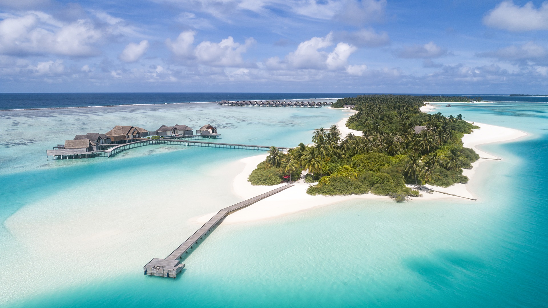 Couple cycling on the island - Niyama Private Islands Maldives
